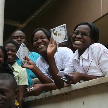 Ladies holding up a multimedia dvd