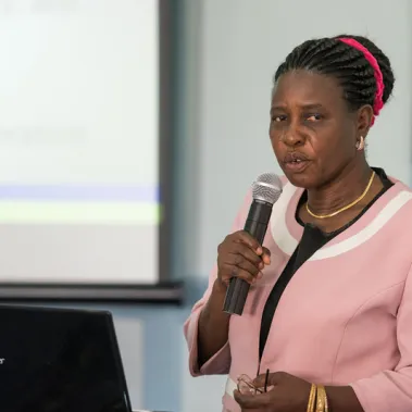 Lady talking into a microphone